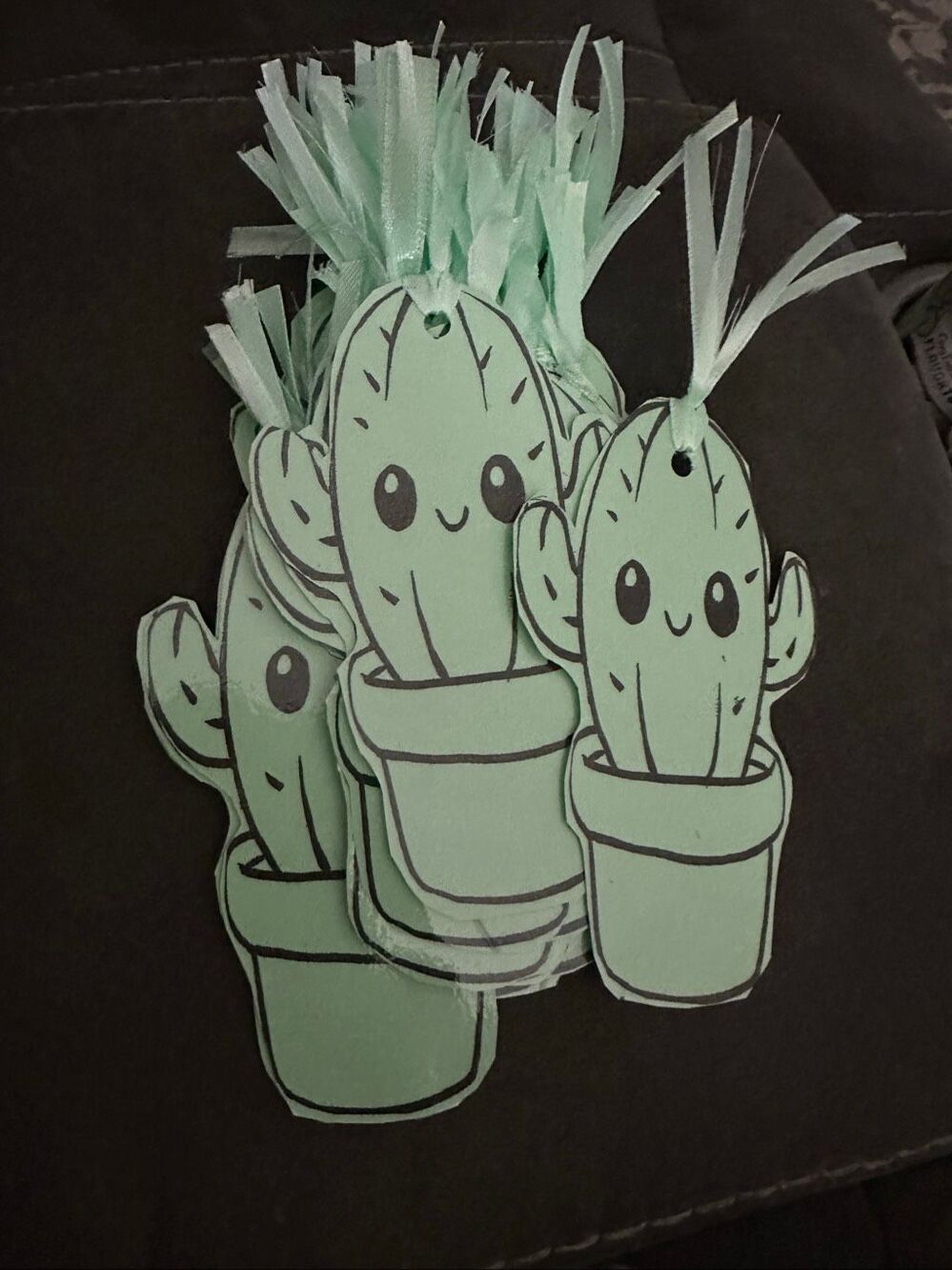 handmade light green paper bookmarks laminated (40)featuring a cute cartoon kawa